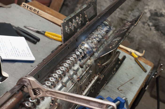 using a piece of angle iron as a ladder fixture