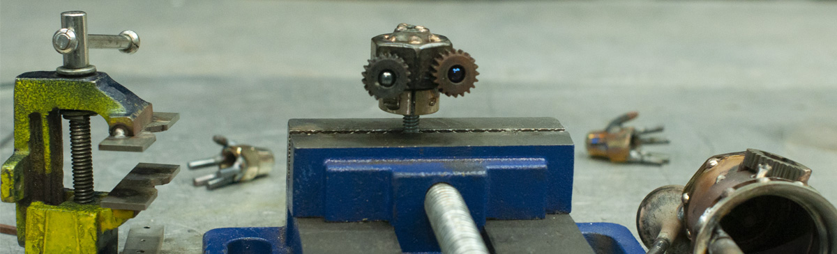 robot head in a vise, under construction