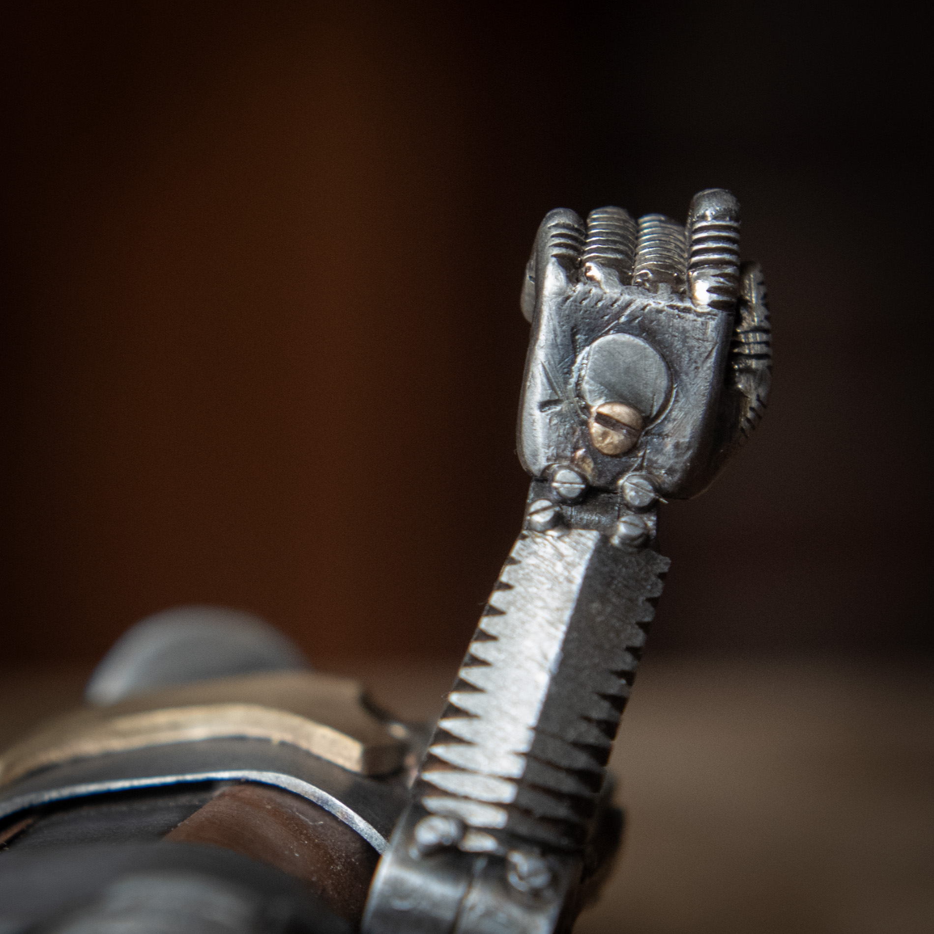 The underside of a tiny hand belonging to a robot sculpture